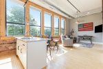 East facing windows highlight the kitchen, dining & living space